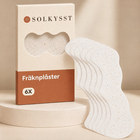 Solkysst Fräknplåster: asken och de vita plåstren med fräknmönster